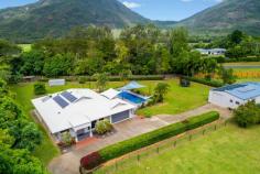 66 Dempsey Street Gordonvale QLD 4865 $895,000 This beautifully presented family property has everything that's required to make that easy transition into acreage living... The stunning home offers an enviable choice of living, dining and entertaining areas which flow seamlessly out to a vast covered alfresco entertaining area that overlooks a sparkling in-ground pool with kids slide. Centrally located, the chef's kitchen is complete with granite bench tops and an abundance of storage, ensuring preparing family meals or entertaining on a grand scale is done with ease and elegance. - Walk In Pantry / Gas Cooking - Two Drawer Dishwasher - Split System Air Conditioning - Solar Power ( 5kw )& Solar Hot water ( 46 Panels in Total ). The master bedroom provides comfort in size, there is a walk in robe and spacious ensuite with his & her vanity's and showers. The remaining three bedrooms have builtins, split air conditioning and the complete home is fully tiled. The shed measures in at 17m x 9m in size, there is power and water connected and four extra high roller doors. ( Space for your large boat and caravan ). At the front of the shed there is an added granny flat with bathroom, separate toilet and split system air conditioning. ( ideal for the older child or family friend that comes to stay ). There is also a doubled sized garden shed for storage of mowing / gardening equipment. This property is fully fenced with two street access, automatic entry gates, established gardens & privacy hedging. Gordonvale is 25 minutes drive South of Cairns CBD, there is shops, schools, doctors, sporting facilities, hotels and much much more. - 35 Minute Drive To Cairns Domestic & International Airport For More Information or Your Private Inspection Phone Brian Bolton 0n 0402 440 098 FEATURES: • Air Conditioning • Built-In Wardrobes • Close To Schools • Close To Shops • Close To Transport • Garden..