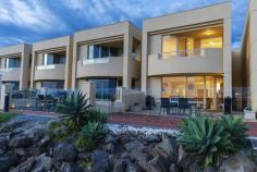 11B Alexa Road North Haven SA 5018 $749,000 - $795,000 A resort lifestyle is yours to enjoy all year round. This beautifully presented townhouse has large picture windows and uninterrupted views over the marina that offer a vista of blue sky, boats, and the occasional inquisitive dolphins. As you enter the property you will be instantly impressed with the polished Tasmanian Oak floors that lead to the open plan living area, deluxe kitchen with stainless steel appliances, Essastone bench tops, glass splash back and large brekkie bar. These areas flow through to a private alfresco living area. The ground floor also offers a soundproof home theatre (one side of the double garage), third bathroom and lockup garaging. Upstairs to the 3 large bedrooms. The main has views over the marina and boasts an ensuite, walk in robe and opens to a private balcony. Bedrooms 2 & 3 also open to a balcony and are adjacent to the main bathroom. WHAT WE LIKE. • Sought after combination of a home and holiday home. • Home theatre. • Secure private jetty. • Water title to the property. • Easily maintained grounds. • Split system reverse cycle air conditioning throughout. • Garaging with secure internal access. • Easy access to cosmopolitan Semaphore Road. • Short stroll to cafes and entertaining precinct. The perfect place to end a busy day with a backdrop of the marina. A home where you will enjoy entertaining and love from the moment you move in.