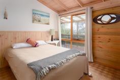 7 Caringal St Waratah Bay VIC 3959 $785,000 Secluded and private offering the perfect space to unwind, only 5 minutes stroll to the pristine coastline in this sought-after location. Sit on the elevated decks, taking in the treed outlook and water glimpses, and listen to the sounds of the sea. Open plan interior with a wonderful feeling of space from high raked ceilings and large areas of glass taking in garden views. ‘L’ shaped living / dining room, well appointed kitchen with abundant storage and preparation areas, breakfast bar to meals area. 3 double sized bedrooms, central bathroom, separate w.c., laundry / utility area. Under house storage, lock up garage plus storeroom which would easily convert to a family / games room. Immaculately maintained and economic to use with solar power, solar hot water, NBN and satellite TV. Being sold fully furnished so ready to enjoy for summer or to generate income from holiday rentals. Come and discover the delights of this picturesque coastal township where the bush meets the beach and the pace is relaxed no matter the season.
