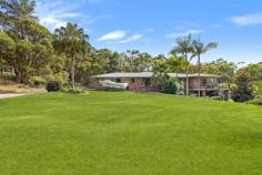 2 Dawson Street Somersby NSW 2250 Nestled on a very quiet, 4.25-acre block about 5 minutes’ drive from the Somersby Industrial Estate and the M1 and approximately 35 minutes to Wahroonga and 10 minutes to Gosford, this expansive & elegant home flows over two levels. The main entry level offers 3 large living areas, beautiful kitchen, 4-bedrooms (main with ensuite & walk-in robe) and an oversized double garage and workshop. The living areas flow out to a wide, wrap around concrete verandah and floor to ceiling windows capture superb forest views. The upper level has high ceilings and combustion fire and split air conditioning for year round comfort. Downstairs is a vast rumpus room complex with adjacent toilet, large laundry and two more separate, multipurpose rooms, all flowing to undercover, outside living/entertaining areas. There are additional useful storage rooms on this lower level. The land is semi-cleared with low maintenance gardens, open lawns and multiple benched areas and tracks through rainforest slopes. A walkway leads down the escarpment to Narara and nearby schools. Features: • Air Conditioning • Balcony • Open Fire Place • Outdoor Entertaining • Rumpus Room • Water Tank.