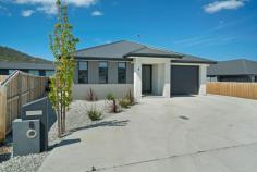 6 Banksfield Street Rokeby TAS 7019 $525,000 From the street, the lovely landscaped rock garden marries beautifully with a contemporary design residence that pleases the eye immediately of what seems a modest size home however when you step through the double glass front doors you are hit with grandeur, an expansive living area that features superb design and an impressive space for the heart of this home. The open living room upon entrance encompasses the lounge area, dining and centre piece quality kitchen that is a real attraction in this large room which even has space for a pool table, making this area perfect for entertaining. The sleeping quarters offers two rooms with built-in robes while the large master has a walk-in-robe and quality en-suite finished in light tones. The main bathroom replicates this design while featuring a nice deep bath. The lavatory is a separate room. The generous entertaining deck is internally accessed from the living area which leads to a level landscaped yard. The garage encompasses the laundry and offers good storage space while the additional external car space provides excellent OSP. This property is a pure delight, impressive in design and style throughout with expansive living spaces that would suit a variety of lifestyles. If you are looking for a quality stylish modern home this is the one. FEATURES: • Air Conditioning • Built-In Wardrobes • Close To Schools • Close To Shops • Close To Transport • Deck • Garden..