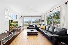 21 Sylvania Road Umina Beach NSW 2257 This unique hillside home is perched high above the neighbouring properties, with 4 bedrooms, a study room and 4 bathrooms, all within a few minutes walk to the golden sands of South Umina Beach. On the ground level is a single garage with a large workshop and under house storage, then up to the next floor is a formal entry from the porch, a large living area with a wet bar and a main bedroom with an ensuite and walk-in wardrobe. Outside and under house on this same level, is an external study room and a 4th bathroom/combined laundry with a staircase up to the backyard. On the highest level are 3 more bedrooms with built in wardrobes, including a 2nd main bedroom with an ensuite, a main bathroom, a huge living room leading out onto the deck with a lovely North East aspect and a small ocean view, a modern kitchen with a separate dining area that leads out to the back deck and the lovely terraced backyard. With solar panels to almost eliminate power bills and being literally a few hundred metres walk to the beach, this home is in the prime sought after pocket of South Umina Beach, so don't delay to call Phil McCord now on 0417 260056 to arrange an inspection of this unique cascading home.