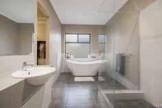 15 Grenadier Street Two Rocks WA 6037 $400,000's * OPEN BY APPOINTMENT – PLEASE CALL CRISTINA ON 0458 003 972 TO VIEW * Looking for a property that exudes style, charm and sophistication? This opportunity is not to be missed and is only available to lucky investors as there is a fixed lease in place with amazing tenants until November 2021! Situated opposite parkland, this 4 x 2 home not only offers the lucky new homeowner value, but also tranquility and views! The curbside appeal with its modern architecture, soft lighting and landscaped garden is only just the beginning for what awaits you inside. Step inside and a sense of space, light and flow entices the senses. Spacious living areas, quality fittings and recessed ceiling are a signature statement throughout this home. The spacious master with walk-in robe is complemented by an en-suite which is both functional and absolutely stunning, with a high back oval bathtub and frameless glass shower. Three spacious double bedrooms, complemented by a modern family bathroom, ensure that every member of your family is well taken care of. The gourmet kitchen with stylish centre island, floating shelves, pantry, and stainless steel appliances overlooks the lounge and dining. Entertaining is easy with a private alfresco which is framed by low maintenance gardens bordered by pretty planter boxes. With a short drive to the Two Rocks Marina, shops and cafes, this home is your ideal investment! Features include but are not limited to: • Four spacious bedrooms • Spacious living areas • Quality fixtures and fittings • Ducted and zoned reverse cycle aircon • Feature recess ceilings • Easy care manicured gardens • Double garage with shopper’s entry • Rent: $380 per week Please note – the furnishings displayed in the marketing photos are not the furnishings currently at the property.