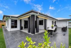 18 MALONE DRIVE ANDERGROVE QLD 4740 $580,000 Located in the most sought-after cul-de-sac in Andergrove, you will find this stunning family home that oozes quality & luxury throughout, in such a central location, minutes from Woolworths, schools, takeout and service stations. This freshly painted impressive family home will cater for everyone. With high ceilings hosting new modern fans & large indoor and outdoor entertaining areas, the beautiful open plan living flows seamlessly and is the perfectly balance between luxury and practicality. The Master Bedroom is located at the back of the house, with direct access to back patio and away from the other three bedrooms. With massive walk-in robe leads to the luxurious ensuite featuring, large spa bath, double vanities, separate shower and toilet with full-size bath for the longest of soaks! The kitchen is large & well positioned, boasting optimal bench space plus storage and flows beautiful to the huge living and dining area. The kitchen overlooks the beautiful alfresco dining areas that reach over brand new, modern stunning tiles (used recently on The Block!) & continue to the huge expanse of slate look tiles around the entire perimeter of the home, made even more comfortable by the addition of large outdoor awnings to enhance your entertaining experience - these tiles & additional awnings are clear examples that the meticulous owners have not spared any expense to ensure superior quality through the entire home. Three other generously sized bedrooms with luxurious carpet that feels great under foot, built-ins with recently serviced air conditioners are all found at the front of the home, leaving privacy & supremacy for the Master Suite. There is also large storage cabinet that creates a hallway adjacent to the bedrooms, sectioning them off nicely for the rest of the house. The spacious bathroom is large enough for all of the kids to share in harmony! The laundry has large bench space, storage and direct access outside to the washing line with easy-maintenance look alike slate tile surrounds. The front entry is just stunning & so welcoming for guests, with the beautiful slate look tiles enhanced with a modern feature tile, creating a pathway from the driveway to front door with established gardens adding extra privacy in the front bedrooms. The double bay remote panel lift roller door allows entry into the oversized double garage with direct entry into the central living area of the home. A third roller door allows drive-through access on vitrified load bearing slate tiles into the back yard with new privacy fencing, but double side gate access allows even greater access if required. Lawn Locker storage on the other side of the backyard provides all storage needs. Disclaimer: The vendors and/or their agents do not give any warranty as to errors or omissions, if any, in these particulars, which they believe to be accurate when compiled. Prospective purchasers should satisfy themselves by inspection or otherwise as to the accuracy of the particulars.