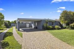 25 Kennedy St Blairgowrie VIC 3942 $900,000 - $990,000 Filled with light and natural ambience, a bank of concertina doors create a seamless connection with the outdoors at this delightful three-bedroom home just a short walk to Blairgowrie’s long sandy beach and along the shore to the village cafes. Immaculately presented with a real holiday vibe and superbly positioned, a wide brick-paved driveway leads up to a double carport and the front door, while a second driveway journeys past the house to a lock-up garage at the rear with plenty of room to store all the beach toys. A sun-trap courtyard deck and living area with polished timber floors and a crisp white colour scheme is the entertaining heart of the home with a separate dining area boasting a timber feature wall. The kitchen is timeless in all white finishes and includes a ceramic cooktop, stainless-steel wall oven and dishwasher, room for a breakfast table and a handy servery to the lounge. A sparkling main bathroom offers a shower, bath, modern vanity and chocolate colour scheme, while the master bedroom provides parents with a gleaming all-white ensuite and walk-in robe. The home also features split-system airconditioning, a covered rear veranda, secure front gates and easy-care gardens to give you more time at the beach!. Hockingstuart | Belle Property is proud to be offering this property for sale. To arrange an inspection or for further information, please contact Tony Colles on 0407 382 140 tony.colles@belleproperty.com