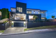 4 Wattle Avenue BIGGERA WATERS QLD 4216 $895,000 Built over 3 levels is this quality modern luxury villa which has to be seen to be appreciated!!! Features include:- - Separate entrance & own private driveway - 4 bedrooms, 3 bathrooms + powder room - Master with walk in robe and luxury ensuite - Exquisite Ceasar stone ultra modern kitchen with large walk in pantry - Spacious open plan living areas - Large North facing outdoor balcony with views - Rear patio and courtyard area - Fully ducted reverse cycle air conditioning - Featured timber and glass stairway - Fully fenced with intercom, security alarm & auto double lock up garage There's been no expensive spared so please phone me on 0413700377 to organise your inspection & be prepared to be impressed.!!!