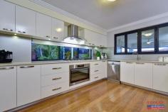 8 Tallerack Street Carramar WA 6031 $700,000's *** GRAND OPENING SUNDAY 22nd NOV 2.15PM – 2.45PM *** Carramar’s premium selling agents are proud to have been selected to present this remarkable 4/5-bedroom, 3-bathroom, residence to the market. Individually designed for the discerning owners & built by the award-winning Aveling Homes; buyers searching for the ultimate in style, space & finish will be instantly captivated by this home. Located in the highly sought after ‘Wildwood Private Estate — Carramar’, in a whisper quiet street; viewing is highly recommended & will not disappoint! Features & benefits include: * Timeless contemporary street appeal * Wide entrance door * Entrance hall with recessed ceiling * Home office/study * Hotel style master bedroom suite with large walk in robe & ensuite with double shower, his & hers vanity with stone bench top, spar bath and separate WC * Spacious, open plan family & meals areas * Storage cupboard * Chef’s kitchen with Essa stone bench tops, breakfast bar, large walk in pantry, double fridge/freezer recess with cold water feed, glass splashbacks, plenty of cupboard space overhead & under bench, stackable windows opening to the alfresco & stainless steel appliances including 900mm oven, cooktop & rangehood * Well-appointed laundry, off the kitchen, with stone bench top, shoppers access from the garage & plenty of cupboard space over head & under bench * Activity room/5th bedroom with sliding door robe * Home theatre with projector, screen, triple, sliding door storage closet, recessed ceiling & stackable, sliding doors leading to the alfresco * 3 further generous bedrooms with built in, sliding door robes & ceiling fans — bedroom 2 with semi-ensuite access to the family bathroom & bedrooms 3 & 4 both with access semi-ensuite access to the 3rd bathroom * Family bathroom with bath, shower & vanity with stone bench top * 3rd bathroom with shower, twin vanity with stone bench top & WC * Separate powder room * Sliding door linen/storage closet * Stepped cornice * Bamboo flooring * Reverse cycle, zoned air conditioning for year-round comfort * Solar electricity system * Stunning alfresco with stepped cornice, ceiling fans & zip track blinds * Liquid limestone * Sparkling, below ground pool with frameless glass pool fencing * Grass area * Koi pond * Garden shed * Double, remote garage with extra width & height * Large 622sqm block * Close to schools, parks, shops & all other local amenities Don’t miss out! Call Team Demo to arrange your viewing!