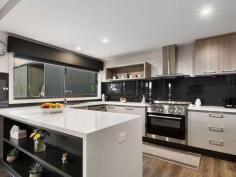 35 Kareen Court Mansfield VIC 3722 $970,000 • Luxurious North facing brick home set on generous 5963m2 (1.5 acres) allotment • Opportunity to further subdivide the land STCA once covenant lifts Dec 2020 • Huge shed with 3 phase power, fully-lined roof, 3 roller doors & open end bay • The magnificent kitchen is the heart of the home with quality stainless steel appliances • Expansive open plan living & dining area flows seamlessly out to undercover alfresco • Lavish parent's wing includes a huge master suite plus a separate sitting/TV area • At the opposite end of the home 3 additional bedrooms all with robing • Spacious main bathroom with shower & bath with separate toilet • Keep comfortable all year round with ducted heating & cooling throughout • Sit back & enjoy the ambience of the crackling wood heater in the cooler months • Laundry with walk in linen/storeroom & concrete pathway to clothesline • Energy efficient with double glazed windows, solar HW, north facing & good insulation • Remote control double garage with direct internal access into the house • Established nectarine, apple, fig, lemon, olive, plum, peach & cherry trees • Fantastic position in a quiet court, minutes to High Street with all town services..