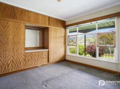 11 Willow Walk Austins Ferry TAS 7011 This property has been a much loved home, being in the same family since being built by the current owners’ father in the late 1950s. It is in original condition with generous proportions including a very large living room and kitchen along with three good sized bedrooms (all with original built ins). This home is ripe for a relatively straight forward upgrade to make it a truly impressive family home. There is a double garage as well as a large workshop and ample under house storage. All this on a massive, gently sloping block of almost 2000 square metres providing incredible development potential. Both subdivision and strata development appear to be strong possibilities (subject to Council approval). In a lovely quiet, original part of Austins Ferry – the property is close to all important services including schools, shops, sporting factilities, transport and Government services. A new owner could upgrade the existing home and sit on the land for future development, or there are a range of potential development options that could be explored sooner. With the St Virgil’s School close by, along with the world renowned Museum of Old and New Art (MONA), in addition to excellent facilities in nearby Claremont and Glenorchy – this is a fantastic location. With a blank canvas available the opportunities are endless. All details provided are based on the best information available, whoever prospective owners should make their own investigations through the relevant authorities in terms of possible future development.