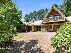 135 CUMMINS ROAD MANSFIELD VIC 3722 Perfectly located only a short 200 m stroll to Lake Eildon this spectacular parklike 4 acre property has been lovingly established by current owners to create their own private botanical gardens surrounding three beautiful tree lined dams all overlooked by a magnificent solid clinker brick two story residence built by current owner/ builder to exacting standards and quality. Features include: 2 separate living zones including a billiard/games room with central OFP. 4 bedrooms, main bed upstairs with full ensuite, walk in robe and large balcony overlooking gardens and lawn edged dam. Large family sized kitchen and separate dining area Brick feature walls to all living areas Undercover al fresco BBQ area 3 toilets Gigantic 4 car garage and workshop with direct internal access to dwelling Large under net veggie gardens and Orchard providing abundant produce. This remarkable 4 acre property provides the ideal peaceful setting for a family sanctuary only minutes stroll to Lake Eildon at the end of a quiet country lane.