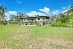 386 Intrepid Drive Foreshores QLD 4678 Set back from the road amongst the gum trees, a spacious high set metal pole frame home is situated. Overlooking a huge front manicured yard where Kangaroos can be seen grazing in the grass from wrap around verandah with front & back entertaining areas. An idyllic lush bushland oasis set on approx. 58 acres. and backs onto the local creek for fishing . Local boat ramp access just down the road minutes from the property. Features: *Open planned living, dining & kitchen area & floating timber flooring throughout *Spacious kitchen with ample storage, dishwasher & free standing oven *Four bedrooms 3 rooms with mirrored built in robes & ceiling fans *Main bathroom with combined shower & bath plus large laundry *High set home fully concreted underneath with potential to enclose underneath *Huge 20x12 mt workshop shed with power and full length 20x6 mt (approx.) annex on one side *2 x 20 mt lockable shipping containers next to shed *Above ground swimming pool *200,000 litre rainwater tank *2 dams near fenced house yard with 5kw pump *Fully fenced property with 5 fenced paddocks & boundary fenced leading into tidal creek *Power supply has been upgraded from a 10 to a 25kw transformer *Assorted fruit trees and garden patch *School bus pick up & close to boat ramp