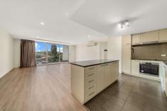 129/72 College Street Belconnen ACT 2617 This private and freshly painted two bedroom apartment is located in the popular "Oracle" complex offering a leafy outlook across neighbouring parkland and with distant views to Mt Painter and Black Mountain Tower. With the apartment vacant and move in ready it's perfect for busy professionals, first home buyers or investors who want to access the rental market. The spacious and light filled apartment offers open plan living with a great flow from your first step inside. Accommodation includes two generous size bedrooms, both with built in robes along with the convenience of two modern bathrooms featuring large shower recesses and marble benchtops. The central kitchen offers a combination of granite and marble benchtops and is well equipped with a dishwasher, new oven and ceramic cooktop. The expansive covered patio is sure to please those who like to entertain - the perfect locale for winding down at the end of the day with your friends, whilst sitting back and enjoying the distant views. If you are career minded or lifestyle driven this apartment is certainly one not to be missed. The central location is unbeatable and is so close to employment opportunities, and educational facilities, whilst only a short stroll away is Lake Ginninderra's Boardwalk, Westfield Shopping Centre, popular cafes, restaurants, and the Belconnen bus interchange. The Blue Rapid bus stop is close and provides direct routes to the University of Canberra, Radford College, the ANU and the city. Features include: • Elevated and leafy outlook • Corner position on the sixth floor • Two bedrooms, both with built in robes and new Luxaflex honeycomb blinds • Master bedroom with RC/AC and spacious ensuite • New engineered Hybrid vinyl flooring throughout - a fantastic floating floor which is 100% waterproof, and very durable • Modern kitchen with Miele dishwasher, new cooktop, oven and generous bench space • Abundant storage along entrance wall • Living room with RC/AC and downlights • Sparkling main bathroom • European laundry with dryer • Open plan living and dining with floor to ceiling windows and sliding doors out to covered outdoor patio • Basement side by side parking for two cars and conveniently located at the lift entrance • Basement storage cage • Apartment available for immediate occupation • VDSL2 - offering generous internet speed • Ample visitors parking • Intercom and restricted lift access • Outdoor swimming pool • Indoor gymnasium • Outdoor BBQ, picnic and recreational area.