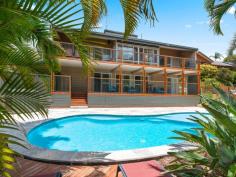58A Marika Way CURRUMBIN WATERS QLD 4223 A perfect balance between peaceful hinterland living and the active community lifestyle of the Gold Coast, this lush oasis ticks all the boxes for leisure, livability and location. Located on a substantial 2,917 sqm of land, this multi-level home is the entertainer's dream. The house is comprised of multiple living and dining areas, complete with an open plan chef's kitchen with double oven and induction stove. The cathedral ceilings let in an abundance of light and airflow, creating a sense of space and grandeur. Take advantage of the separate living quarters downstairs, consisting of a guest bedroom, ensuite, living room with home bar area and a spacious undercover deck overlooking the large in-ground swimming pool. The handy man's dream, the home is completed by a good-sized workshop and plenty of under-the-house storage space. Features: • 4 bedrooms total - privately located master's with walk-in-robe, ensuite and personal balcony • Double lock-up garage with plenty of storage - extra storage space under house and in the workshop - large driveway with parking option for a caravan or boat • Large entertainer's deck on both ground level and first floor offering alfresco dining and barbeque area • Large in-ground pool with shallow section - ideal for younger kids to play in • Local school bus stops in front of the house Located at the end of a quiet cul-de-sac, the land backs onto the tranquility of Tierney Park and Currumbin District Horse Club. It is only minutes away from the area's popular beaches, shops, restaurants, local schools and stunning nature locations such as Currumbin's renowned rockpools and organic growers' markets. You will be spoilt for choice as to where to spend your spare time. Choose a lifestyle that fits all your needs and book an inspection with us today.