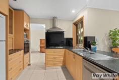 33 Baltimore Avenue Morphett Vale SA 5162 $399,000-$429,000 Located amongst other quality homes in the popular 'Thaxted Heights Estate' close to Woodcroft Shopping Centre and Woodcroft College is this beautifully presented family home set in a quiet cul-de-sac location. Ideal for any growing family the modern flexible floor plan offers a combination of both formal & informal living, a central kitchen, three bedrooms, a sensational outdoor entertaining area and room for multiple vehicles. A tiled entrance leads you to a spacious L-shaped formal lounge & dining area with bar on your left and the master bedroom is to your right. Comprising of three carpeted bedrooms, the main features a bay window, a walk-in robe and ensuite bathroom, while bedroom two has a ceiling fan and a built-in robe. A three-way family bathroom offers a large vanity unit with good storage including a linen press, a separate toilet and a shower & bathtub. The well-appointed kitchen has been cleverly designed, boasting a walk-in pantry, a breakfast bar and stainless-steel appliances including dishwasher, wall oven, hotplate & rangehood. It overlooks the open plan meals area & family room, which has all-year-round comfort courtesy of reverse cycle air conditioning. Beautifully fitted out with gorgeous timber cabinetry and some feature lead lighting, the bar is the perfect place to serve up a few drinks for friends while everyone enjoys watching the game on the big screen tv in the adjoining living area. The outside entertaining area is the outstanding feature of this home, a massive gable roofed pergola with all-weather cafe blinds, ceiling fans and lights will be the host of many birthday celebrations, family gatherings and plenty of good times to cherish forever. Positioned on a huge block of around 940m, the garden has been designed for an easy up-keep with a grassed area for the kids & pets to run, garden beds with established, easy care plants & trees, plus a fernery down one side of the house. The single carport has a manual roller door with drive through access to the large garage/workshop, offering power & lights, concrete floor and a workbench - it is a very handy space. The driveway is wide enough to park a boat or a caravan - still with the potential to park more vehicles behind the gates. Situated in a cul-de-sac ensures the safety and tranquillity for you and your family, while the laneway next door offers the convenience of easy access to the highly regarded Woodcroft College & Library, the Woodcroft Tavern for a quick meal & the Town Centre Shopping Mall for all your groceries. Located within close distance to medical services, recreational facilities, several parks & reserves, early learning centres and public transport.