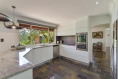 459 Kyola Road Kulnura NSW 2250 This elevated, quiet and private 27 acre holding includes approximately 10 acres of beautiful clear to semi-clear flat to gently sloping land, together with an impeccably presented large 4-bedroom home with extensive undercover alfresco entertaining area and pool, all set off by a world class Australian Native garden, offering a stunning array of spectacular Australian flora & fauna! A substantial 12.5m x 12.5m steel shed complete with 3-phase power tops off this unique package and has separate access. Separate adjacent shed, 15.8m x 4.8m. Water is plentiful via both rain tanks and bore supply for garden irrigation system. The area is a mecca for horse enthusiasts with entry opposite this property to the McPherson State Forest riding trails. The home has a near new quality kitchen, spacious bedrooms, main with ensuite, delightful main bathroom, and multiple large living areas, both formal and informal. Floor coverings and window treatments are all to a high standard. There is air conditioning and a large combustion fire. The home requires no work by the new owners and offers a wonderful retreat for buyers wanting a peaceful, rural lifestyle on the back doorstep of the Central Coast and Sydney. Access to Wahroonga is via the M1 and is under 1-hour driving, while the facilities of the Central Coast are less than 30 minutes away.