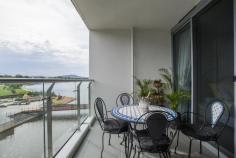 64/11 Trevillian Quay Kingston ACT 2604 Lakefront' on Kingston Island offers exclusive apartments on the shoreline of Canberra's premier waterfront precinct with nearby parks and national buildings including the National Gallery of Australia. Situated to the north of the new Kingston foreshore harbour, this apartment has water views of the canal,the East Basin of Lake Burley Griffin and Black Mountain Tower. With restaurants at your doorstep, Lakefront is only minutes to the Parliamentary zone, airport, railway station, Kingston retail centre, Manuka retail and movie theatre, and the City Centre. It is close to numerous entertainment centres. public transport and employment hubs. Located on level 4, Unit 64 offers a tranquil water outlook from the covered balcony and glass-walled living area with large glazed sliding doors. This 61m2 one bedroom unit has a floor plan which the architect has designed to make the most out of its aspect towards Lake Burley Griffin. Fixtures and fittings throughout the apartment are high quality with the ensuite bathroom featuring a luxurious stone top double vanity and stunning floor to ceiling marble tiles. Residents enjoy luxury resort-style living, including a fully equipped gym and a landscaped courtyard leading to an infinity pool for their exclusive use. Features overview: • Top level inclusions and fit-out • Secure allocated basement car space and storage enclosure • Lift access • Secure intercom entry to building for guests • Northerly outlook to Lake Burley Griffin • Unique floor plan with extensive use of glass to provide a light-filled residence • Ducted heating and air conditioning • Kitchen with marble floor tiles, stone benchtop and Miele gas cooktop, dishwasher and oven • Bathroom with stone top double vanity and floor to ceiling wall tiles • Well equipped gymnasium • Infinity swimming pool overlooking Lake Burley Griffin • Pet friendly (subject to body corporate notification)