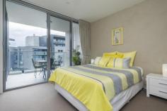 64/11 Trevillian Quay Kingston ACT 2604 Lakefront' on Kingston Island offers exclusive apartments on the shoreline of Canberra's premier waterfront precinct with nearby parks and national buildings including the National Gallery of Australia. Situated to the north of the new Kingston foreshore harbour, this apartment has water views of the canal,the East Basin of Lake Burley Griffin and Black Mountain Tower. With restaurants at your doorstep, Lakefront is only minutes to the Parliamentary zone, airport, railway station, Kingston retail centre, Manuka retail and movie theatre, and the City Centre. It is close to numerous entertainment centres. public transport and employment hubs. Located on level 4, Unit 64 offers a tranquil water outlook from the covered balcony and glass-walled living area with large glazed sliding doors. This 61m2 one bedroom unit has a floor plan which the architect has designed to make the most out of its aspect towards Lake Burley Griffin. Fixtures and fittings throughout the apartment are high quality with the ensuite bathroom featuring a luxurious stone top double vanity and stunning floor to ceiling marble tiles. Residents enjoy luxury resort-style living, including a fully equipped gym and a landscaped courtyard leading to an infinity pool for their exclusive use. Features overview: • Top level inclusions and fit-out • Secure allocated basement car space and storage enclosure • Lift access • Secure intercom entry to building for guests • Northerly outlook to Lake Burley Griffin • Unique floor plan with extensive use of glass to provide a light-filled residence • Ducted heating and air conditioning • Kitchen with marble floor tiles, stone benchtop and Miele gas cooktop, dishwasher and oven • Bathroom with stone top double vanity and floor to ceiling wall tiles • Well equipped gymnasium • Infinity swimming pool overlooking Lake Burley Griffin • Pet friendly (subject to body corporate notification)