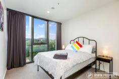 36/15 Irving Street Phillip ACT 2606 $499,000 Those looking for a home or investment property that offers access friendly features, genuine space, gorgeous views and resort style facilities are invited to inspect this stunning, as new apartment. THE HOME The large open plan living space consists of a lounge and dining area drenched in natural light from the generous floor to ceiling double glazed windows. Sliding doors lead out to the outdoor, covered balcony, the perfect spot to enjoy your favourite drink and enjoy its panoramic views. A chef's dream, the kitchen is beautifully finished with stone bench tops, generous storage and two-tone cabinets. Appliances are quality Smeg items including the induction cooktop. The European style hide-away laundry is integrated within the kitchen space and includes a washer/dryer. There are two full size bedrooms, at opposite ends of the apartment, adjacent to their own bathrooms. The main bedroom features a walk-in robe and second bedroom has a large built-in robe. The bathrooms are of standout quality with floor to ceiling tiling, generous storage & high-end finishes that will impress. Ensuring everyone is comfortable year-round are three Panasonic split system air conditioners. Secure basement parking is included for two vehicles, one being an extra wide accessible space, plus there's additional lockable storage. 'Ivy Woden' residents enjoy use of the rejuvenation centre with indoor and outdoor pools, a spa, sauna, separate weights and cardio gyms, both indoor and outdoor yoga spaces, an outdoor bowling green and outdoor entertaining/recreational areas. THE LOCATION 'Ivy Woden' is perfectly positioned, only minutes to Woden Town Centre including a number of major government agencies, Westfield Shopping Centre, Canberra Hospital, Calvary John James Hospital, public transport options plus a growing list of cafés and restaurants. The apartment is just 8km from the Parliamentary Triangle making cycling to work a breeze.