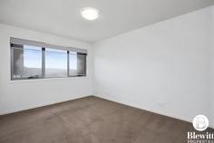 116/41 Philip Hodgins Street Wright ACT 2611 Located in the sought after location of Wright you will find this spacious 2 bedroom ensuite apartment that offers a balcony with endless views!! The property boasts an open plan design decorated in modern neutral colours, both bedrooms have built-in robes and stunning mountain views. The main bedroom has an ensuite adding to the appeal. The open plan kitchen and living area opens out to the covered balcony. The kitchen is spacious and offers stone benches, dishwasher and ample cupboards. New timber look floors run through the entire living area. You will find a reverse cycle air conditioner to keep you comfortable year round. There is a single secure car parking space with storage cage. Features: – Large open plan design – New timber look floors throughout – 2 bedrooms with built in robes – Main bedroom with ensuite – Kitchen with stone benches – Reverse cycle air conditioner – Balcony with excellent views – Single secure car accommodation – EER 6.0 – Rates $372 p/q – Land Tax if rented $448 p/q – Body Corp $816 p/q..
