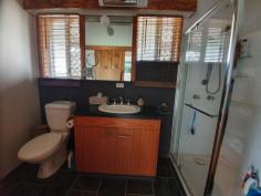 595 BROOKLANDS ROAD NANANGO QLD 4615 $335,000 Well presented property situated only 4 minutes from Nanango. Featuring cathedral ceilings with exposed timber beams, open plan kitchen with electric cook-top and oven with generous cupboard and bench space. There are 2 main bedrooms both with air conditioning and 1 has built in wardrobe. The 3rd bedroom is in a separate living quarters linked via a deck making it ideal dual living with air conditioned and loads of cupboards for storage. This property has full Security screens installed on all doors and windows, a wrap around veranda to compliment a deck area perfect for entertaining. 2 KW solar system with near new inverter, 6 x 6m shed perfect for a workshop with a 6 x 6 m carport and two 6 x 3m sheds to accommodate cars and caravan. Concrete under ground water tank that holds Approx 40,000 ltrs and a poly tank holding approx. 5,500 ltrs, enclosed vegetable garden, fully fenced 14 acres with dam.