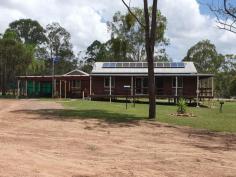 595 BROOKLANDS ROAD NANANGO QLD 4615 $335,000 Well presented property situated only 4 minutes from Nanango. Featuring cathedral ceilings with exposed timber beams, open plan kitchen with electric cook-top and oven with generous cupboard and bench space. There are 2 main bedrooms both with air conditioning and 1 has built in wardrobe. The 3rd bedroom is in a separate living quarters linked via a deck making it ideal dual living with air conditioned and loads of cupboards for storage. This property has full Security screens installed on all doors and windows, a wrap around veranda to compliment a deck area perfect for entertaining. 2 KW solar system with near new inverter, 6 x 6m shed perfect for a workshop with a 6 x 6 m carport and two 6 x 3m sheds to accommodate cars and caravan. Concrete under ground water tank that holds Approx 40,000 ltrs and a poly tank holding approx. 5,500 ltrs, enclosed vegetable garden, fully fenced 14 acres with dam.