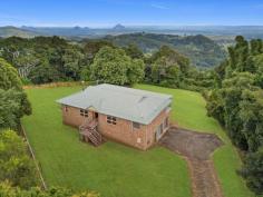 15 ALFS ROAD BALD KNOB QLD 4552 Situated high on Bald Knob is this beautifully built 3-bedroom brick home. Bald knob is just minutes to the townships of Maleny and Montville and is perfectly positioned for those looking to enjoy the best of the Sunshine Coast Beaches, the Hinterland itself and further beyond to Brisbane. With stunning rural and mountain views this home is looking for a new family, and with its neutral canvas the opportunities are endless. Property Features: - 3 good sized bedrooms - 2 bathrooms - 2,000m2 block - Open plan living - Large dining kitchen with wood fireplace - Large verandah to take in the stunning views - Polished blackbutt floors throughout - Huge garage and workshop with vehicle pit and 3.4m high ceilings - Large storeroom and laundry Boasting a cavernous garage and workshop; it's perfect for the home mechanic or there may be the opportunity to convert it for dual living perfection. Now is your time to secure views and a Hinterland lifestyle that just can't be had anywhere else.