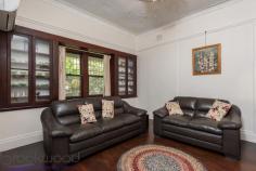 48 Harper St Woodbridge WA 6056 $569,000 The invitation of a deep front porch, an impressive, timber entry hall, leadlight pocket doors, decorative ceilings, and double casement windows will make anyone with vision, passion and a sense of romance swoon with delight at every turn. Built in the 1920s, with an air of quality, this 3 bedroom, 2 bathroom home has occupied its elevated corner lot with grace and beauty for almost 100 years and now awaits a new heart to enchant. • 3 bedrooms 2 bathrooms • 1920s-built character home • Front porch to lrg entryway • Studio, cellar, attic, garage • Original jarrah floorboards • Splendid leadlight windows • Renovated kitchen/meals • Formal lounge w built-ins • Elevated 679m corner block • Opposite Swan River Reserve Don’t miss the chance to restore this utterly charming home to its full glory. An abundance of original features and the initial builder’s quality features provide a persuasive outline of the magnificence waiting to be fully revealed. As you step into the entry hall, the depth of treasure that awaits is immediately apparent. A double-height ceiling, wide jarrah floorboards and panelled walls bring to mind old Hollywood movies where mildly chaotic families lived in grand craftsman-built homes. The timber panelling conceals a door leading to the secret cellar and separate, double undercroft garage. A staircase with deco-style balusters leads up to a long attic, used as the third bedroom, with views of the Swan River and foreshore reserve opposite. Pocket doors with leadlight panels open from the formal entry hall to reveal a lounge room with wide jarrah floorboards, an ornate recessed ceiling dome and deep-sill windows flanked by glass-fronted built-in Jarrah cabinets. Well-proportioned rooms with high ceilings offer a framework throughout the home while original features bring inimitable character. The greatest joy of this property is that it has been little altered. As a result, double-hung sash windows, stained glass and lead lights, decorative architraves, bullnose corners and textured plaster are waiting to be restored to their former glory and take pride of place in a modern renovation with a rich heritage. The kitchen/meals area has been updated. Gleaming white tiles surround the original fireplace bringing a contemporary aesthetic without obscuring history. A garden window offers a touch of whimsy and vintage style while the open-plan layout and split system A/C is a nod to modern sensibilities. Two large bedrooms sit to either side of the end of a central hallway. Bullnose corners create a sense of space by opening the hallway and allowing for easy movement between the bedrooms and the family bathroom. The main bedroom features a decorative ceiling, picture rail and double sash windows looking onto the front garden. The adjoining ensuite, with shower, vanity and W.C. is a more modern addition. In the second bedroom, a leadlight window, high ceilings and timber floors fashion a flexible room that will delight children of all ages and is large enough to share. The family bathroom includes an over-tub shower, vanity and W.C. A stand-alone studio with a kitchenette and bathroom sits to one side of a central lawn. This multi-purpose space has previously been utilised as a guest suite and teens’ retreat. A central lawn edged with raised garden beds separates the studio from the home’s original outbuildings sitting at the property’s eastern boundary. With a desirable, elevated, corner location opposite the Swan River and foreshore reserve, and set within walking distance of Guildford Grammar and Woodbridge Train Station, this property is well placed for the present and the future. Outside of the Woodbridge Conservation zone and not heritage listed, the property does not place restrictions on your imagination or desires. Integrate the integrity of the original architectural features with your personal requirements and reawaken this remarkable family home. Blending a sense of adventure and a splash of surprise with a sprinkle of magic, the irresistible lure of this property is undeniable. To arrange an inspection of this property or for friendly and honest assistance with any of your real estate needs, call Mr Happy – Ross Webster – 0407 387 004.