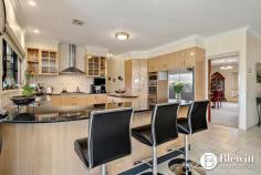 28 Beacon Place Googong NSW 2620 $2,100,000 With commanding 360-degree views from the top of the hill sits this grand residence sprawling over 557.1m2 under one roof line. There is an additional 113.7m2 of verandahs plus covered entertaining areas as well as garaging. The property has surveillance cameras, electric gate and intercom. Through the gate you are lead up the long tree and light-lined sealed driveway to the grand home. The home consists of a large formal lounge and dining room at the front that leads you to a stunning open plan kitchen and family meals area which overlooks the rear entertaining areas and gardens. The kitchen is an entertainer’s dream offering endless stone benches and storage. There is also a walk-in pantry that is large enough to get lost in. Down the extra wide hallway, you will find the massive rumpus/media room. This home offers a parent’s retreat like no other the size of which needs to be seen to be believed. This walk-in robe is fashionista’s dream and the large resort style ensuite offers spa, large shower, separate toilet and heated floors. The remaining 3 spacious bedrooms all offer built-in robes. This home offers two studies, the main study boasts its own entrance and is large enough to be split into 2 additional bedrooms. The second study is located at the opposite end of the home, providing flexible study/work from home options. There is a large three-way main bathroom which services the three bedrooms. Adjacent to this area is the functional and spacious laundry. At the garage end of the home there is a powder room. The oversized 3 car garage provides excellent storage and workshop space along with remote roller doors and internal access. There is also an oversized double garage perfect for any additional machinery. The fully fenced house yard is irrigated, landscaped and offers large level lawn areas along with easy care and established gardens including vegetable beds and fruit trees. There are front and rear covered entertaining spaces which overlook gardens and a stunning vista. The remainder of the property has been divided into paddocks with water troughs and shelter for stock. The current owners run Alpacas on the property. Features: – Grand formal lounge and dining room – Stunning open plan kitchen and family room – Large rumpus/media room – Retreat style master bedroom with walk-in robe and ensuite – Remaining bedrooms all spacious in size with built-in robes – Large home office offering its own entrance – Picturesque views from every room – Additional study at garage end of residence – 2.9m ceilings throughout – Double glazed windows throughout – Ducted reverse cycle air conditioning with 6 zones – Large covered entertaining spaces either side of the home – Oversized 3 car garage attached to house – Additional 2 car garage, 6m x 7m – Double carport attached to house – 110,000ltr concrete rainwater tank – Additional large water tank attached to shed – 500kl per annum bore water supply – 3 phase power to home – 240v power to front gate with driveway lights – 40+ solar panels – Sealed driveway – Automated irrigation system to gardens and lawns – 557.1m2 of house plus 113.7m2 of verandas 670.8m2 total covered – 2.41 Hectares (5.9 acres)