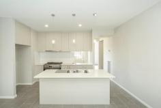 2/43 William Street Wodonga VIC 3690 $545,000 Central Wodonga properties are highly sought after… but we’ve found you one! Only 1km from Wodonga’s town centre, this quality built townhouse is beautiful, modern, and offers the lifestyle convenience that only comes from living in the heart of town. This perfectly appointed upmarket townhouse is one of two on the block on its own title. Positioned to the rear on a low maintenance 467m2 (approx.) lot, leaving you nothing to do but to enjoy all the creature comforts this home has to offer. The floor plan was designed with practicality in mind, and constructed with particular attention to detail. Comprising of three large bedrooms, the master suite is located to the front on the home and offers walk-in-robe smartly fitted out with built in cabinetry, and a stunning ensuite with double shower, wall to ceiling tiles, with a separate toilet. The remaining bedrooms offer built-in-robes and are serviced by the beautifully appointed family bathroom. The light and bright open plan living/dining area with northerly aspect, sits adjacent to the modern kitchen with walk-in pantry, s/steel appliances, stone benchtops, soft close draws, breakfast bar with pendant light fittings, and 900mm gas cooker. Ducted heating and cooling will provide year round comfort and the large tiled living area and entry ensures the common areas are easily maintained. The home also features high ceilings, a study nook off the grand formal entrance, downlights, modern décor and tasteful modern colour palette throughout. Outside you will find an undercover alfresco area which leads from the living area, double lock up garage with internal access to the pantry, as well as additional off street parking. Please call Terry on 0412 793 331 to organise your private inspection without delay as this property will be highly sought by many and will not last long!