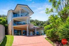 19 Anniversary Place COFFS HARBOUR NSW 2450 $1,400,000 This 3 level contemporary residence is ideally positioned to capture the views over Coffs city and out to the ocean and beyond. Every detail has been thought of with loads of space set over three levels. Living areas are encased by full-length sliding doors opening onto expansive balconies enhancing the feeling of a holiday location. There are 7 bedrooms, 3 bathrooms plus a powder room and multiple living areas as well as a huge theatre room. On the top level there is a 50m² parent's retreat with fabulous views right out to the ocean. Downstairs there is guest accommodation ideally suited to Airbnb that is fully self-contained and has its own courtyard backing onto a National Park. Relax and enjoy a huge heated swimming pool that is self cleaning, with surrounds ideal to entertain with friends and have a cool drink. This home has a 5,000 Litre underground water storage tank, Solar electricity panels, security system alarm and reverse cycle air conditioning.