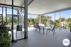 4 Coastwatch Close KORORA NSW 2450 $1,375,000 - $1,425,000 Located in one of Korora's most sought after enclaves, this 4 bedroom architecturally designed home delivers the best of coastal living and is only footsteps from the sands of Korora Bay Beach. The grandeur of this home with its size and architecturally curved roof line, you will appreciate that this home is in a class of its own. Designed over 3 levels, the floor plan provides private spaces for all members of the family, capturing the ocean views and northerly aspect. Level 1 offers large living and dining spaces for relaxed family living and the natural warmth of the polished timber floors adds ambiance to the home. The high-end entertainers kitchen with stone benchtops and sleek cabinetry is well appointed and fuses the outside entertaining area with indoor living, taking advantage of the sea breezes. There are 2 queen size bedrooms and the media/cinema room on this floor. On the upper floor there is a master suite with its own balcony including a huge luxury en-suite and walk-in robe as well as a lounge area providing a private space and commanding views out over Korora Bay. On the lower level there is a 4th bedroom with ensuite that overlooks the pool and gardens. There are so many features in this home including the revolutionary Ritek triple insulated roofing system that has a high thermal rating reducing energy costs, auto oversized triple garage as well a huge storage area currently used as a home gym. There is even a spare room that could be used as a work from home office. The beautiful outdoor areas lovingly wrapped around tranquil gardens are the real standout with an amazing (10x5m) in ground swimming pool and deck complete with built-in entertaining gazebo designed to create a perfect beachside lifestyle.
