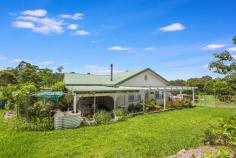 1901 Wisemans Ferry Road Central Mangrove NSW 2250 This centrally located and delightful, RU1 zoned, 40-acre package offers a blend of comfortable accommodation with approximately 15 acres of good gently sloping pasture, multiple dams, and good fencing with rainforest areas, running stream and great potential for further development. The 3-bedroom home is roomy, comfortable, well maintained and presented. Home is air-conditioned with combustion fire. Roof was recently re-sheeted and external walls re-clad. A large covered alfresco area makes outdoor living very comfortable adjacent to a manicured tiered garden and house yard lawns. There are numerous healthy fruit trees. The slab and fireplace of the original home, along with building frame and roof are still located next to the main building and offer the convenience of a potential refurbished second home S.T.C.A. A 4-bay steel shed, 2-bay lockable and 2 open offers substantial storage space. A 22,500-litre concrete tank is provided to receive water from the lower spring fed dam, following some overhaul of the pumping system and several rainwater tanks are holding rainwater from roof collection. Fencing is well thought out and generally in good condition creating several paddocks and a well-defined house yard of approximately 800 sqm. A delightfully landscaped garden and lawns finish off the picture. The property is located just 12 minutes to the M1 and less than 40 minutes to Wahroonga so is on the back doorstep of both Sydney and the many convenient facilities of the beautiful Central Coast.