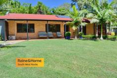  10 RIVENDELL ROAD ARAKOON NSW 2431 $950,000 Positioned on a private, resort-like 2.5 acres (1.035Ha) this property is 5 minutes from Gap Beach, 10 minutes to Smoky Beach & Trial Bay. The beautiful landscaped grounds include a pool, windmill & two cabanas. The home is a very comfortable 3 bedroom home, all bedrooms with built-ins. The main bedroom has walk-in robe, air-conditioning, ensuite. the property also has 9 foot ceilings, timber flooring, throughout with tiled dining area that flows out to undercover all weather entertaining area. There is plenty of water out there with a 22,000 Litre underground tank to service the house plus the 2 other tanks of 15,000 Litre and 5,000 Litre for outdoor usage. If you're looking for sheds then this property has a 3 car garage plus workshop, 8 bay shed & a storage shed. Be quick for this one. 