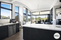 4 Coastwatch Close KORORA NSW 2450 $1,375,000 - $1,425,000 Located in one of Korora's most sought after enclaves, this 4 bedroom architecturally designed home delivers the best of coastal living and is only footsteps from the sands of Korora Bay Beach. The grandeur of this home with its size and architecturally curved roof line, you will appreciate that this home is in a class of its own. Designed over 3 levels, the floor plan provides private spaces for all members of the family, capturing the ocean views and northerly aspect. Level 1 offers large living and dining spaces for relaxed family living and the natural warmth of the polished timber floors adds ambiance to the home. The high-end entertainers kitchen with stone benchtops and sleek cabinetry is well appointed and fuses the outside entertaining area with indoor living, taking advantage of the sea breezes. There are 2 queen size bedrooms and the media/cinema room on this floor. On the upper floor there is a master suite with its own balcony including a huge luxury en-suite and walk-in robe as well as a lounge area providing a private space and commanding views out over Korora Bay. On the lower level there is a 4th bedroom with ensuite that overlooks the pool and gardens. There are so many features in this home including the revolutionary Ritek triple insulated roofing system that has a high thermal rating reducing energy costs, auto oversized triple garage as well a huge storage area currently used as a home gym. There is even a spare room that could be used as a work from home office. The beautiful outdoor areas lovingly wrapped around tranquil gardens are the real standout with an amazing (10x5m) in ground swimming pool and deck complete with built-in entertaining gazebo designed to create a perfect beachside lifestyle.