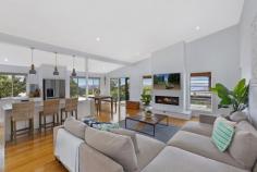 32 THE BASTION UMINA BEACH NSW 2257 Soaring to new heights, this stunning family home is a labour of love and showcases modern elegance, superb space and versatility with filtered water views. Designed with impeccable taste and exceptional craftmanship, it’s a home of impressive proportions, with 2 open plan living zones merging with impressive outdoor entertaining terraces over 2 levels. Soaring ceilings, oversized bedrooms and bathrooms, and quality inclusions all come together to offer the best in coastal living. This home boasts dozens of impressive features including, but not limited to: - Master bedroom with private balcony, luxurious en suite and walk-in robe - 3 oversized bedrooms with built-in custom cabinetry - Bonus 5th bedroom or office - Gourmet kitchen with custom island and quality stainless-steel appliances - 6 burner gas cooker/oven, dishwasher & plumbed double fridge - Both bathrooms contain a shower and bath - Indoor/outdoor dining and entertaining zones - Open plan casual living space with handy powder room and feature gas fireplace - 2nd downstairs lounge room with custom built study zone - Split system air conditioning, LED lighting and ceiling fans throughout - Beautiful, landscaped gardens and grassed play areas for kids or pets (cubby house included) - Single lock up garage with internal access - Additional driveway parking for cars/trailer/boat/caravan - Huge under-house storage area - All located in the peace and quiet of Umina Heights Rarely does a property of this calibre and class come on the market. Call Anthony McVicker on 0498 112 351 to inspect this outstanding property today.