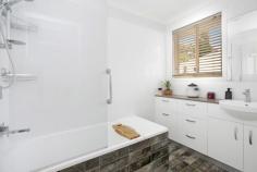 12 Eumemmering Street Medlow Bath NSW 2780 $680,000 - $720,000 Situated in the quietest of streets in the charming village of Medlow Bath, located half-way between the well known tourist towns of Blackheath & Katoomba, this beautifully presented brick & tile home will suit a broad spectrum of purchasers looking to secure an easy care, low maintenance residence. Positioned on a dead level 696sqm allotment and only a moment’s walk to train, bush walks, spectacular Mountain views and the famous Hydro Majestic Hotel. Featuring 3 bedrooms, 2 with built-ins, updated kitchen with Ceaserstone benchtops, Mocca glass splashback, 900mm Fagor stainless steel gas cooktop, 2 x Cavallo ovens, Bosch dishwasher, soft-close drawers & bamboo flooring, updated bathroom & separate toilet, spacious lounge with new carpet, light filled sunroom with an abundance of glass, drive through attached garage, huge workshop with adjacent soundproof studio, greenhouse set up for Hydroponics and a garden shed with a plumbed in toilet. Numerous additional features include natural gas connected, Brivis ducted heating, Ventis ducted air flow system, Vulcan gas heater, Radiant overhead heater in sunroom, Fujitsu reverse cycle air conditioning, continuous gas hot water, decorative cornices, ceiling roses & pelmets, underground 1000lr water tank with automatic pump, exceptional paving & brick walling, fully fenced and a security alarm. The current owners have invested heavily into making this property a comfortable and easy care forever home. Their decision to relocate presents a great opportunity for an astute purchaser to move in without hesitation and start enjoying the enviable Blue Mountains lifestyle.