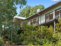 50B Halls Road Myrtleford VIC 3737 $699,000 What better way to combine a work/life balance than this amazing and unique home set on just over 3/4 of an acre(3269 sqm) of natural bush in Halls Road. With a separate air conditioned studio this property offers the room for a home office totally detached from the main house or simply make it a fourth bedroom. Also featuring an elevated full length timber deck set amongst the native trees surrounding the house, this house provides the ideal tranquil setting to escape the chaos of life. Features Include: - 3 Bedrooms plus a separate air conditioned studio/4th bedroom/study. - Master bedroom with large walk in robe and ensuite. - Open plan living. - Central kitchen with electric cooking and dishwasher. - 2nd bathroom with shower and bath and separate toilet. - Polished floorboards throughout. - Length of the house elevated timber deck. - Wood Heater, Split System and Ceiling fans. - Large laundry with plenty of storage. - Double Garage with electric roller door. Call to book an inspection today. FEATURES: • Air Conditioning • Built-In Wardrobes • Formal Lounge • Garden • Polished Timber Floor • Secure Parking