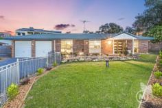 5 Minns Place Everton Park QLD 4053 Located at the top of a quiet cul de sac location and just moments from Everton Park State School, this spacious and beautifully presented family residence is ready for you to call it home. Exclusive agent Justin Hicks is delighted to welcome you to 5 Minns Place. Featuring four bedrooms, two bathrooms and a sparkling in-ground pool, this home is everything your family has been looking for. As you enter via the double door entry, the master suite is located to your right. Set at the front of the home, suite is the only word that can adequately describe this bedroom, with a seating area, gorgeous ensuite and large built-in robe. The heads of the house will be elated with their private suite. The main living and dining area impresses with timber flooring, neutral tones and a large recessed window. Ceiling fans and downlights continue the stylish feel, and sliding double doors lead through to a huge 4th bedroom that would also be the perfect home office setup. The central kitchen features gloss black stone benchtops above white cabinets. The stainless steel oven and electric cooktop will assist in creating your culinary works of art. With the kitchen connecting to the second living area, this is the perfect entertainer’s kitchen. From the second living space, sliding doors lead to a fantastic outdoor entertaining area that overlooks the stunning swimming pool. There is space for casual seating and dining space and creates a perfect afternoon watching the kids splash around while you get the BBQ firing. Two more bedrooms are located to the rear of the home, each with built-in robes and ceiling fans. The family bathroom sits between these bedrooms, with a washbasin and toilet separate from the shower and separate bath. This is an underestimated benefit for any busy household. The generous 862m2 block provides excellent privacy, and with a fully fenced front garden, there is plenty of space for children and pets to roam and play. A remote double garage provides safe parking for your vehicles, and there’s plenty of driveway space for additional cars if required. This fabulous family home will be a hit, thanks to the quality, style, space and that pool. Don’t be left wishing you’d acted sooner; contact Justin today and ask about making 5 Minns Place your new address. At A Glance: Spacious 4 bedroom 2 bathroom family home Master suite with sitting area, ensuite and built-in robe Close to local schools, shops and transport Central kitchen connects to dining and casual living area Stone benchtops and stainless steel appliances Large undercover entertaining area overlooking sparkling pool Generous 862m2 block with fully fenced front garden 4th bedroom ideal for home office or media room Multiple air conditioning systems throughout Easy access to local schools and shops..