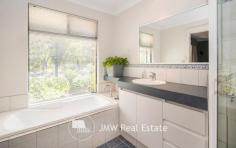 32 Kangaroo Parade Yallingup WA 6282 $1,300,000 to $1,400,000 Situated just a three minute drive from both Smiths and Yallingup beaches, this four bedroom, two bathroom, solar passive, brick and Colorbond home is tucked away on 2.7 acres of peppermint, banksia and redgum bushland. Just a short walk to Studio Bistro and Little Fish restaurants and a two minute drive to Yallingup General Store and Caves House Hotel. This versatile four bedroom home has an open plan living, kitchen, dining area with raised ceilings and a slow combustion wood heater. A generous separate lounge area has an open fireplace. All rooms have bushland outlooks. The living areas and main bedroom face north for winter sun and open out onto a freestanding alfresco area. The home also has a large games room/workshop accessed from the double garage or verandah. The succulent gardens are low maintenance. The bushland has stunning wildflowers in spring including orchids. The home has a fully reticulated vegetable garden and established fruit trees. Water for gardens is supplied by a bore. There is plenty of room for visitor’s cars, caravans and tents. If you are chasing a secluded home or holiday house on acreage close enough to the beach for a morning swim, surf check or evening sunset walk then this is the property for you. Additional Features: * 1.1022ha (approximately 2.7 acres) * 2 x split system air conditioners (living area and games room) * Solar hot water system with electric hot water booster * 13 panel solar system * Huge rain water tank * Bore with self-filling holding tank * 3 huge shade sails between house and freestanding alfresco area * 900mm rangehood, gas hotplate and 600mm oven * Large walk-in pantry * 2002 brick and Colorbond construction * Room to add sheds, granny flat or extensions (subject to approval) * Fenced vegetable gardens * Established fruit trees * Garden shed * Shade house For further information or to arrange inspection please contact your South West Sales Representative Ben Jecks on 0408 545 304 or ben@jmwrealestate.com.au