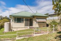 22 Clarke Street Tumut NSW 2720 $289,000 Boasting a surprisingly large floorplan and conveniently located in a quiet cul-de-sac, you will love the options available with this larger style floor plan, with the ability to move straight in whilst you contemplate that dream renovation. Do not miss your opportunity to secure a great home with excellent potential, call today and book your inspection! Premiere Features: - Three bedrooms, large master with built in robes, dresser and ceiling fan - Bathroom with combined shower and bath and single vanity - Quaint kitchen positioned in the heart of the home with electric cooktop and good storage - Open plan dining area with polished timber flooring with split system air conditioning, built-in fire place and ceiling fan - Large semi formal lounge boasting timber flooring and ceiling fan - Internal laundry - Separate toilet positioned to the rear of the home - Formal entry and built-in linen - Quaint back verandah, fully covered - Single carport - Two rainwater tanks - Fully fenced 745m2 allotment - Additional garden shed - Great sized rear yard - Currently tenanted at $280 per week..