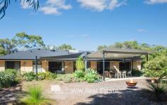 32 Kangaroo Parade Yallingup WA 6282 $1,300,000 to $1,400,000 Situated just a three minute drive from both Smiths and Yallingup beaches, this four bedroom, two bathroom, solar passive, brick and Colorbond home is tucked away on 2.7 acres of peppermint, banksia and redgum bushland. Just a short walk to Studio Bistro and Little Fish restaurants and a two minute drive to Yallingup General Store and Caves House Hotel. This versatile four bedroom home has an open plan living, kitchen, dining area with raised ceilings and a slow combustion wood heater. A generous separate lounge area has an open fireplace. All rooms have bushland outlooks. The living areas and main bedroom face north for winter sun and open out onto a freestanding alfresco area. The home also has a large games room/workshop accessed from the double garage or verandah. The succulent gardens are low maintenance. The bushland has stunning wildflowers in spring including orchids. The home has a fully reticulated vegetable garden and established fruit trees. Water for gardens is supplied by a bore. There is plenty of room for visitor’s cars, caravans and tents. If you are chasing a secluded home or holiday house on acreage close enough to the beach for a morning swim, surf check or evening sunset walk then this is the property for you. Additional Features: * 1.1022ha (approximately 2.7 acres) * 2 x split system air conditioners (living area and games room) * Solar hot water system with electric hot water booster * 13 panel solar system * Huge rain water tank * Bore with self-filling holding tank * 3 huge shade sails between house and freestanding alfresco area * 900mm rangehood, gas hotplate and 600mm oven * Large walk-in pantry * 2002 brick and Colorbond construction * Room to add sheds, granny flat or extensions (subject to approval) * Fenced vegetable gardens * Established fruit trees * Garden shed * Shade house For further information or to arrange inspection please contact your South West Sales Representative Ben Jecks on 0408 545 304 or ben@jmwrealestate.com.au