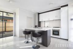 3/32 Burns Street Maidstone VIC 3012 $790,000 - $840,000 This three-bedroom townhouse epitomises spacious and bright living; wrapped up in one of the most desirable streets in Maidstone. Space poses no issue in the dining and lounge area of the home, where large floor to ceiling windows that face out upon the large backyard allow for light to fill the room. A study nook accompanies this space. Enjoy cooking with ease in the stylish and sleek kitchen, with stone benchtops, a double sink, an abundance of cabinets, tiled splashback, chrome accents, European gas appliances and an island bench. A central powder room and separate laundry with backyard access completes this lower level. Newly carpeted stairs guide you to the upper level of the home. The enormous master suite has a prodigious walk-in robe that fulfils all your storage needs and a generous ensuite complete with an oversized shower and vast vanity space. The second and third bedrooms are large, and light filled and are both serviced by double built-in robes. The upper level is completed by a central bathroom with a tub, extended vanity space and ample storage. Located less than 10kms from Melbourne’s city, a range of amenities are made readily available to you. Indulge yourself at the many surrounding cafes and restaurants, unleash the shopaholic within at Highpoint Shopping Centre, travel from the nearby bus/tram stops or immerse yourself in nature at the Maribyrnong River and multiple parklands/reserves close by. Additional features: – Separate laundry with backyard access – Security camera and intercom – Double garage with internal access – Split system heating and cooling in lounge area, master bedroom and upper level – Generous and low-maintenance backyard..