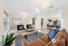 66 Weddin Circuit Palmerston ACT 2913 Surrounded by lush private gardens you will find this grand five bedroom, three bathroom residence that offers uninterrupted views. As you arrive at the property you will admire its palatial presence with the large circular driveway and two storey residence. The double front door leads you into the large entry with feature staircase. On the ground floor you will find the large formal lounge and dining room that open onto the chef’s dream kitchen. The large kitchen boasts stone benches, excellent storage, double ovens and gas cooking. Opening off the kitchen is the family room which in turn opens onto the rumpus room. The spacious and light rumpus room overlooks the back yard and offers access out to the covered entertaining area. The ground level is also home to the fifth bedroom, third bathroom, large laundry and the double garage. The garage offers internal access and double remote roller doors. If you wander up the grand staircase you will find four large bedrooms, main bathroom and large linen cupboards. Three of the bedrooms offer built-in robes with the main bedroom featuring a large walk-in robe and ensuite with spa and double vanities. There is also access out to the front veranda with spectacular views. Outside are the private landscaped gardens that wrap around the entire block. There are level lawn areas along with private entertaining areas and a garden shed to help with extra storage. Features: – Formal lounge and dining room – Open plan kitchen and family room – Rumpus room with access to the entertaining area – Main bedroom with walk-in robe and ensuite – 3 upstairs bedrooms with built-in robes – Downstairs bathroom and 5th bedroom/home office – Freshly painted throughout – Ducted vacuuming – Double garage with internal access and remote roller doors – Circular driveway with additional off-street parking – Private covered entertaining area – Landscaped gardens – EER 3.0