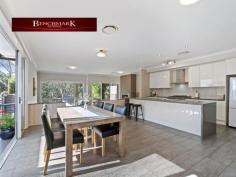 16 Pleasure Point Road Pleasure Point NSW 2172 Spilt level home minutes walk from waterfront reserve parkland and the Georges River. This beautiful property offers a multitude of formal and informal living zones that will suit the growing family looking for easy-care living and vast space. Not often are we given the opportunity to market such an immaculate property on approx. 929sqm in the Pleasure Point Estate. The gourmet gas kitchen is perfectly positioned in the heart of the home - overlooking the open-plan living and dining areas. It features extended stone bench tops serving as a breakfast bar with ample cupboard space and walk in pantry. Features include: - Modern Kitchen with butlers pantry, stone benchtops, gas cooking & quality appliances - Family area with gas fire place - Generous study/ work from home set up - Deluxe master suite with his & hers walk in robe and ensuite - 4 bedrooms with built in wardrobes - Separate Laundry - Alfresco area over looking inground pool with built in BBQ - Spacious 2 car lock up garage - Loads of storage throughout the home - Ducted air conditioning