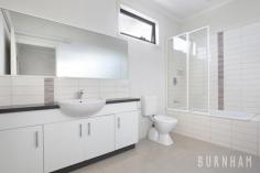 3/32 Burns Street Maidstone VIC 3012 $790,000 - $840,000 This three-bedroom townhouse epitomises spacious and bright living; wrapped up in one of the most desirable streets in Maidstone. Space poses no issue in the dining and lounge area of the home, where large floor to ceiling windows that face out upon the large backyard allow for light to fill the room. A study nook accompanies this space. Enjoy cooking with ease in the stylish and sleek kitchen, with stone benchtops, a double sink, an abundance of cabinets, tiled splashback, chrome accents, European gas appliances and an island bench. A central powder room and separate laundry with backyard access completes this lower level. Newly carpeted stairs guide you to the upper level of the home. The enormous master suite has a prodigious walk-in robe that fulfils all your storage needs and a generous ensuite complete with an oversized shower and vast vanity space. The second and third bedrooms are large, and light filled and are both serviced by double built-in robes. The upper level is completed by a central bathroom with a tub, extended vanity space and ample storage. Located less than 10kms from Melbourne’s city, a range of amenities are made readily available to you. Indulge yourself at the many surrounding cafes and restaurants, unleash the shopaholic within at Highpoint Shopping Centre, travel from the nearby bus/tram stops or immerse yourself in nature at the Maribyrnong River and multiple parklands/reserves close by. Additional features: – Separate laundry with backyard access – Security camera and intercom – Double garage with internal access – Split system heating and cooling in lounge area, master bedroom and upper level – Generous and low-maintenance backyard..