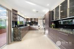 66 Weddin Circuit Palmerston ACT 2913 Surrounded by lush private gardens you will find this grand five bedroom, three bathroom residence that offers uninterrupted views. As you arrive at the property you will admire its palatial presence with the large circular driveway and two storey residence. The double front door leads you into the large entry with feature staircase. On the ground floor you will find the large formal lounge and dining room that open onto the chef’s dream kitchen. The large kitchen boasts stone benches, excellent storage, double ovens and gas cooking. Opening off the kitchen is the family room which in turn opens onto the rumpus room. The spacious and light rumpus room overlooks the back yard and offers access out to the covered entertaining area. The ground level is also home to the fifth bedroom, third bathroom, large laundry and the double garage. The garage offers internal access and double remote roller doors. If you wander up the grand staircase you will find four large bedrooms, main bathroom and large linen cupboards. Three of the bedrooms offer built-in robes with the main bedroom featuring a large walk-in robe and ensuite with spa and double vanities. There is also access out to the front veranda with spectacular views. Outside are the private landscaped gardens that wrap around the entire block. There are level lawn areas along with private entertaining areas and a garden shed to help with extra storage. Features: – Formal lounge and dining room – Open plan kitchen and family room – Rumpus room with access to the entertaining area – Main bedroom with walk-in robe and ensuite – 3 upstairs bedrooms with built-in robes – Downstairs bathroom and 5th bedroom/home office – Freshly painted throughout – Ducted vacuuming – Double garage with internal access and remote roller doors – Circular driveway with additional off-street parking – Private covered entertaining area – Landscaped gardens – EER 3.0
