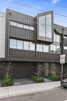  2A Gooch St Prahran VIC 3181 $1,750,000 - $1,925,000 With exclusivity and elegant luxury in mind, this spectacular new north-facing three bedroom, three bathroom townhouse with city views and remote garage presents inspired Prahran living across three lift accessed levels on the edge of Lumley Park. Luxurious internal styling and timeless materials create a unified interior with meticulous attention to detail including engineered herringbone timber flooring, the lavish use of honed marble, 2Pak joinery and a state-of-the-art lift. Soaring ceiling heights and dramatic banks of double glazed windows emphasize the openness and natural light creating a beautiful living environment. The superb north-facing living and dining domain set beneath a cathedral ceiling with a gas fireplace is situated on the top-floor to maximise the sky-high elevated views with a window wall of glazing sliding open to a full-length balcony where the city vistas can be enjoyed in their entirety. The adjoining kitchen combines sublime aesthetics with superb functionality from the luxurious honed marble island bench to the suite of Miele and Fisher & Paykel appliances including an integrated refrigerator. The three bedroom accommodation all integrate 100 per cent wool carpet and excellent wardrobes, while the three decadent bathrooms feature floor-to-ceiling porcelain tiling and brushed nickel tapware and shower, one with a bathtub. A study nook is located on the mid-level, while the ground-floor bedroom opens to the landscaped rear courtyard. Comprehensive appointments include a remote garage with internal access, video intercom, alarm system, European laundry, heating and air conditioning. This is a home of distinction in a prized parkside pocket revered for its ease of access to trams, buses, Prahran East Village, High Street's cafes, Hawksburn Village and Victoria Gardens and Lumley Park. 