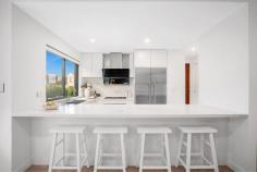 24B Smalls Road Ryde NSW 2112 $1,800,000 Ideally positioned just footsteps to Smalls Road Public School, this flawlessly presented duplex offers modern interiors, ample space and privacy. Its house-sized proportions creates a family-friendly atmosphere and an easy-care way of life. A secure, fenced garden provides safety for young children and pets to play together, combined with a north-facing alfresco ideal for entertaining or relaxing in the sunshine. Situated between Top Ryde City and Macquarie Park, the home also is within close proximity to Yamble Reserve, Midway shops, regular city transport and leading schools. - Immaculately presented throughout, street access from Neville Street - Spacious living areas connect with easy-care gardens and level lawns - Gas kitchen with Smeg appliances, 40mm stone bench and breakfast bar - Powerful and quiet ROBAM rangehood removes odour from the kitchen - Master suite includes bespoke walk-in-robes and a lavish ensuite - Main bathroom has a rainwater shower head, oval bath, luxe tiles - Prestige finishes throughout, tall shadow line ceilings, custom lighting - Zoned ducted air-conditioning, alarm system, plenty of storage