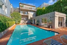 48 Drumalbyn Rd Bellevue Hill NSW 2023 Occupying an elevated position in arguably one of Bellevue Hill’s finest streets, this light filled character home offers free flowing, open plan living areas that have been intelligently designed to maximise space and the stunning northerly views. This is the perfect home for those who like to entertain. The family-friendly floor plan continues with 4 generous bedrooms, all with built-in wardrobes. The spacious master bedroom features a walk-in wardrobe, ensuite plus separate study/sitting room and a private balcony overlooking beautifully manicured gardens and resort style pool. The lower level offers a resort style pool in a private garden setting and includes an adjoining self contained cabana area, ideal for summer parties. Whilst the house is in terrific condition, there is plenty of scope to capitalise on this fantastic block in an absolute Blue Ribbon address. Further features include; + Open fireplace, large built in bar and open plan eat in kitchen + Security, lock up garaging for 2 large cars with internal access + Character home in one of Bellevue Hills finest streets + Multiple living areas, including a cozy winter family room with open fireplace + Spectacular northerly aspect and harbour views + Large poolside cabana that could be used as a gym, separate home office or arts studio + Short driving distance to multiple shopping Villages or centres, a selection of prestigious schools and beaches..