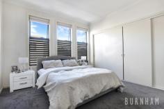 3/32 Burns Street Maidstone VIC 3012 $790,000 - $840,000 This three-bedroom townhouse epitomises spacious and bright living; wrapped up in one of the most desirable streets in Maidstone. Space poses no issue in the dining and lounge area of the home, where large floor to ceiling windows that face out upon the large backyard allow for light to fill the room. A study nook accompanies this space. Enjoy cooking with ease in the stylish and sleek kitchen, with stone benchtops, a double sink, an abundance of cabinets, tiled splashback, chrome accents, European gas appliances and an island bench. A central powder room and separate laundry with backyard access completes this lower level. Newly carpeted stairs guide you to the upper level of the home. The enormous master suite has a prodigious walk-in robe that fulfils all your storage needs and a generous ensuite complete with an oversized shower and vast vanity space. The second and third bedrooms are large, and light filled and are both serviced by double built-in robes. The upper level is completed by a central bathroom with a tub, extended vanity space and ample storage. Located less than 10kms from Melbourne’s city, a range of amenities are made readily available to you. Indulge yourself at the many surrounding cafes and restaurants, unleash the shopaholic within at Highpoint Shopping Centre, travel from the nearby bus/tram stops or immerse yourself in nature at the Maribyrnong River and multiple parklands/reserves close by. Additional features: – Separate laundry with backyard access – Security camera and intercom – Double garage with internal access – Split system heating and cooling in lounge area, master bedroom and upper level – Generous and low-maintenance backyard..